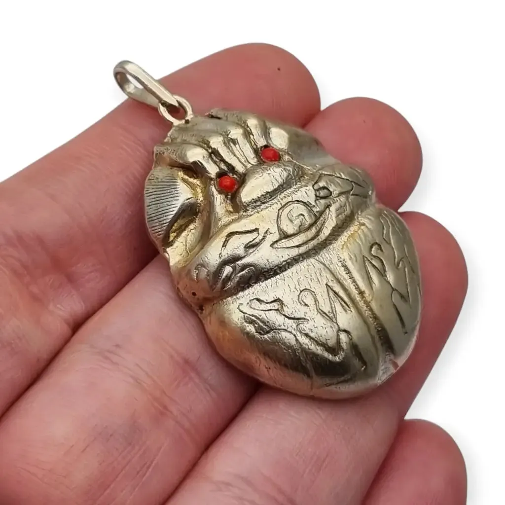 Antique Egyptian scarab amulet made of silver and hieroglyphic engravings, 1980.