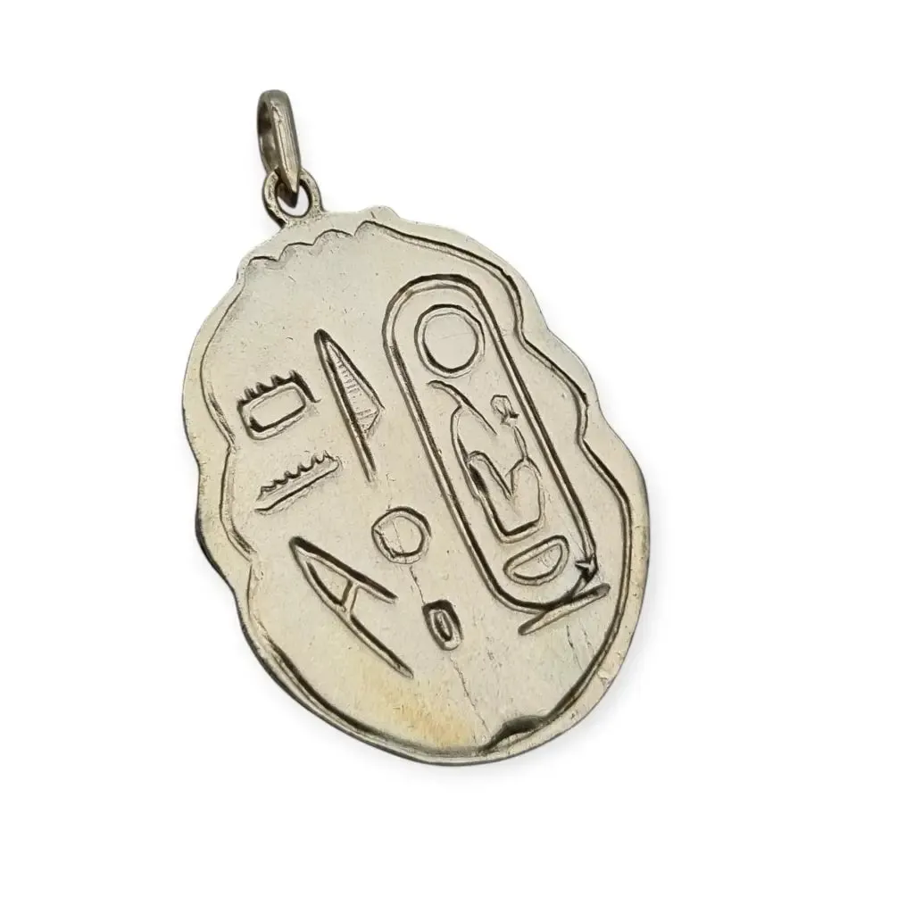 Antique Egyptian scarab amulet made of silver and hieroglyphic engravings, 1980.