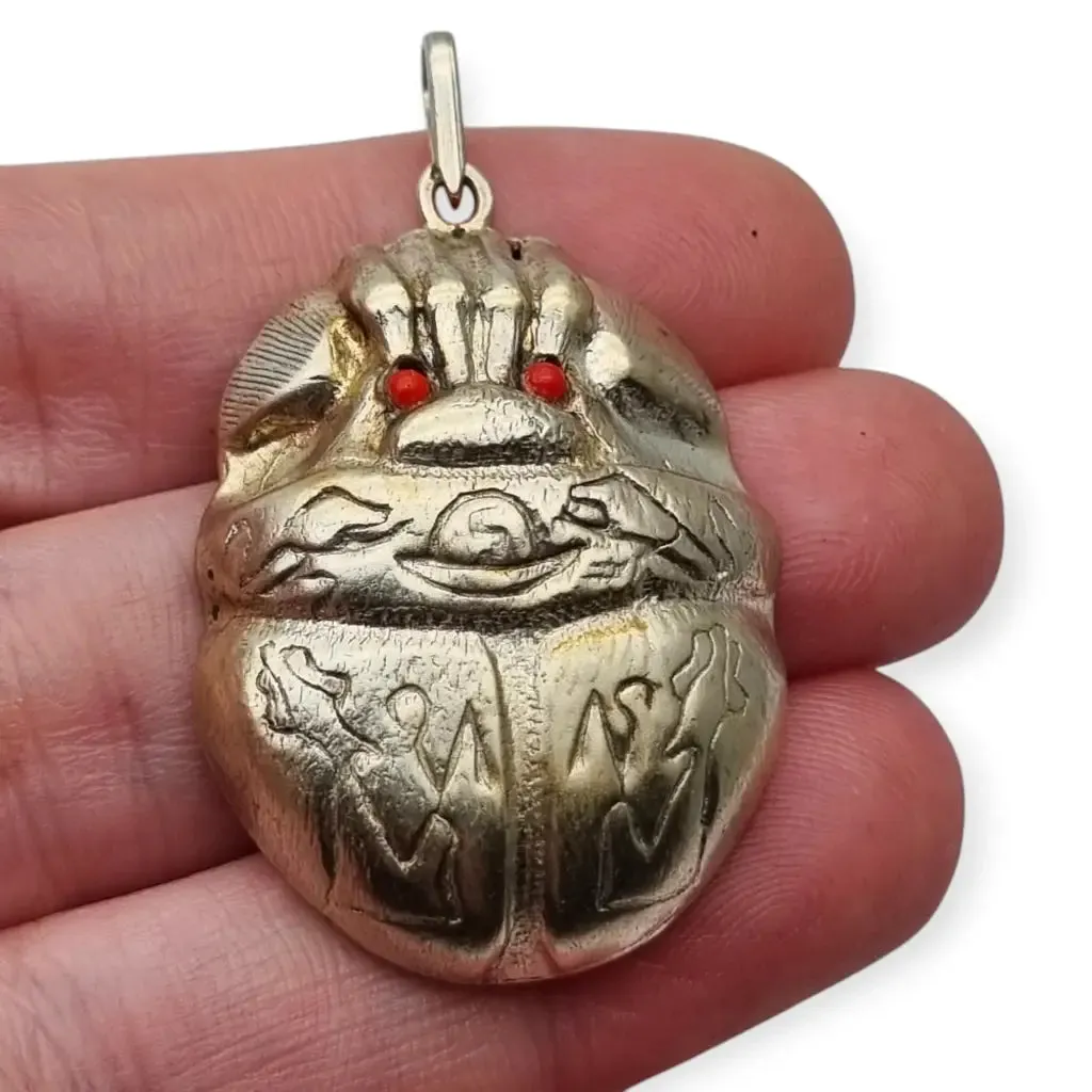 Antique Egyptian scarab amulet made of silver and hieroglyphic engravings, 1980.