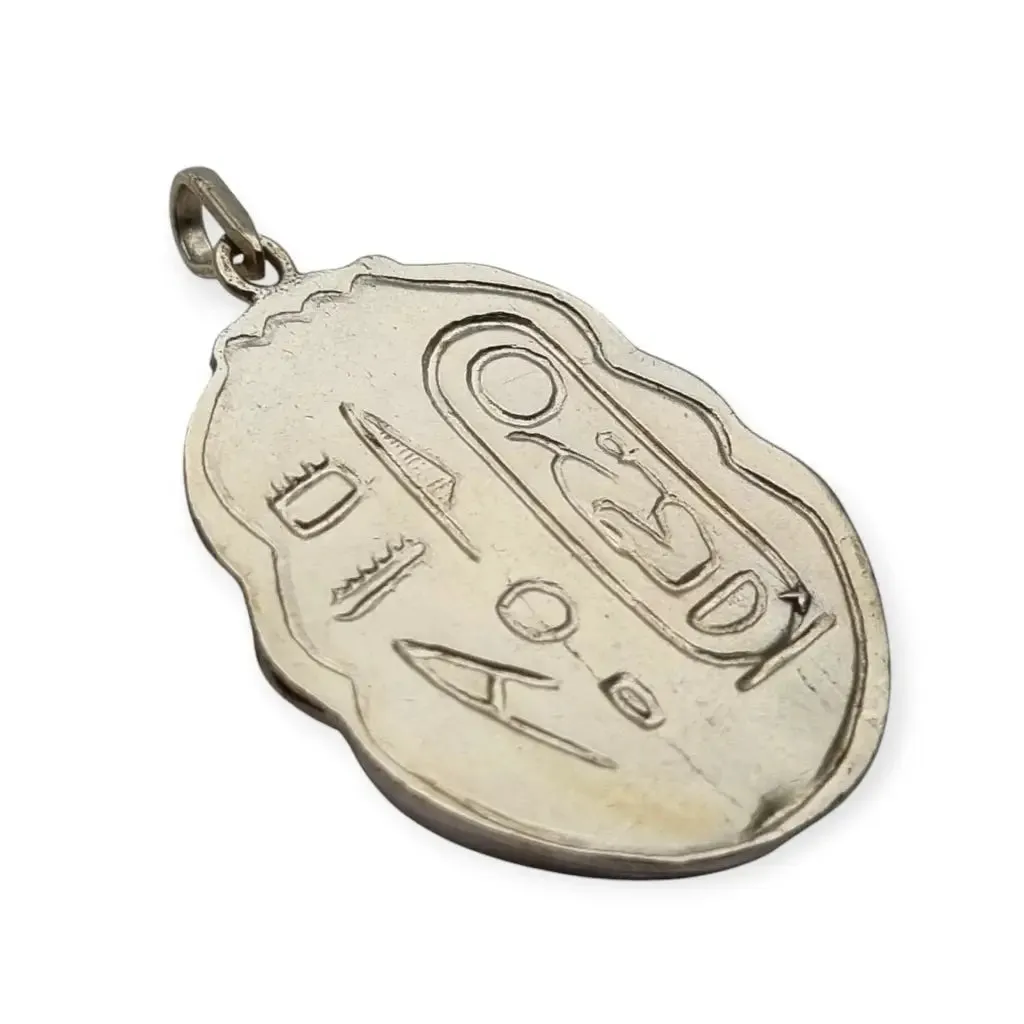 Antique Egyptian scarab amulet made of silver and hieroglyphic engravings, 1980.